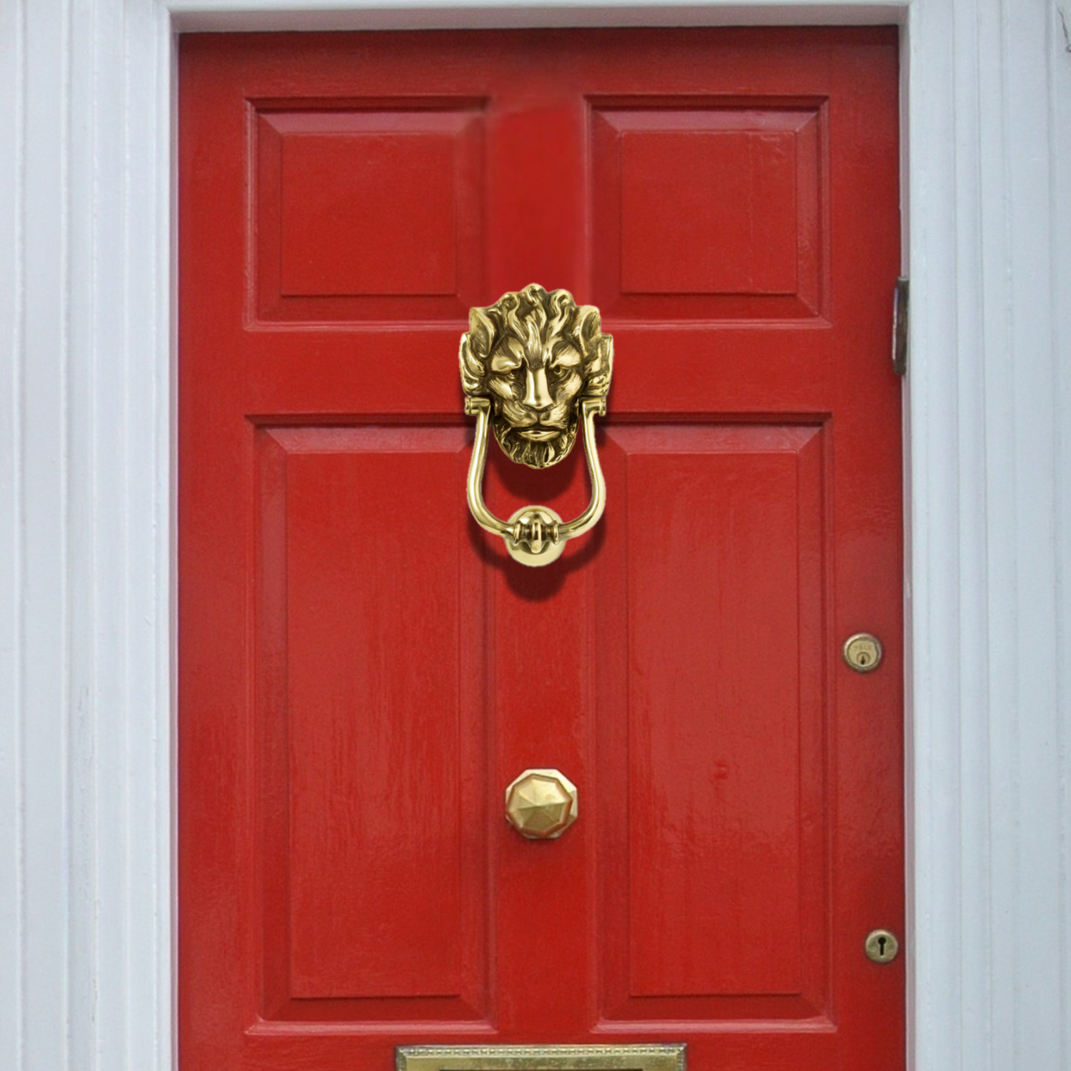 Red door with a gold lion knocker and handle.